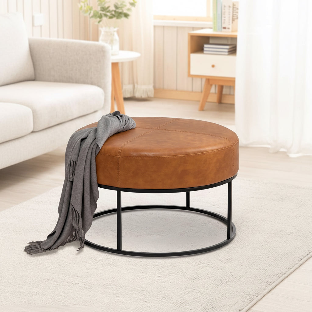 Brown leather ottoman with close-up details in a living room setting