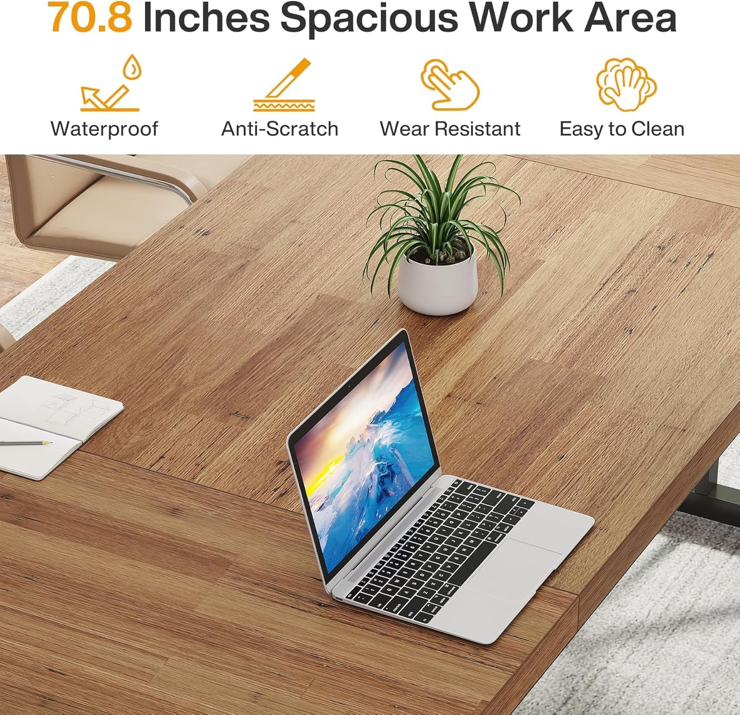 Wooden desk with a laptop, plant, and stationery items on a white background