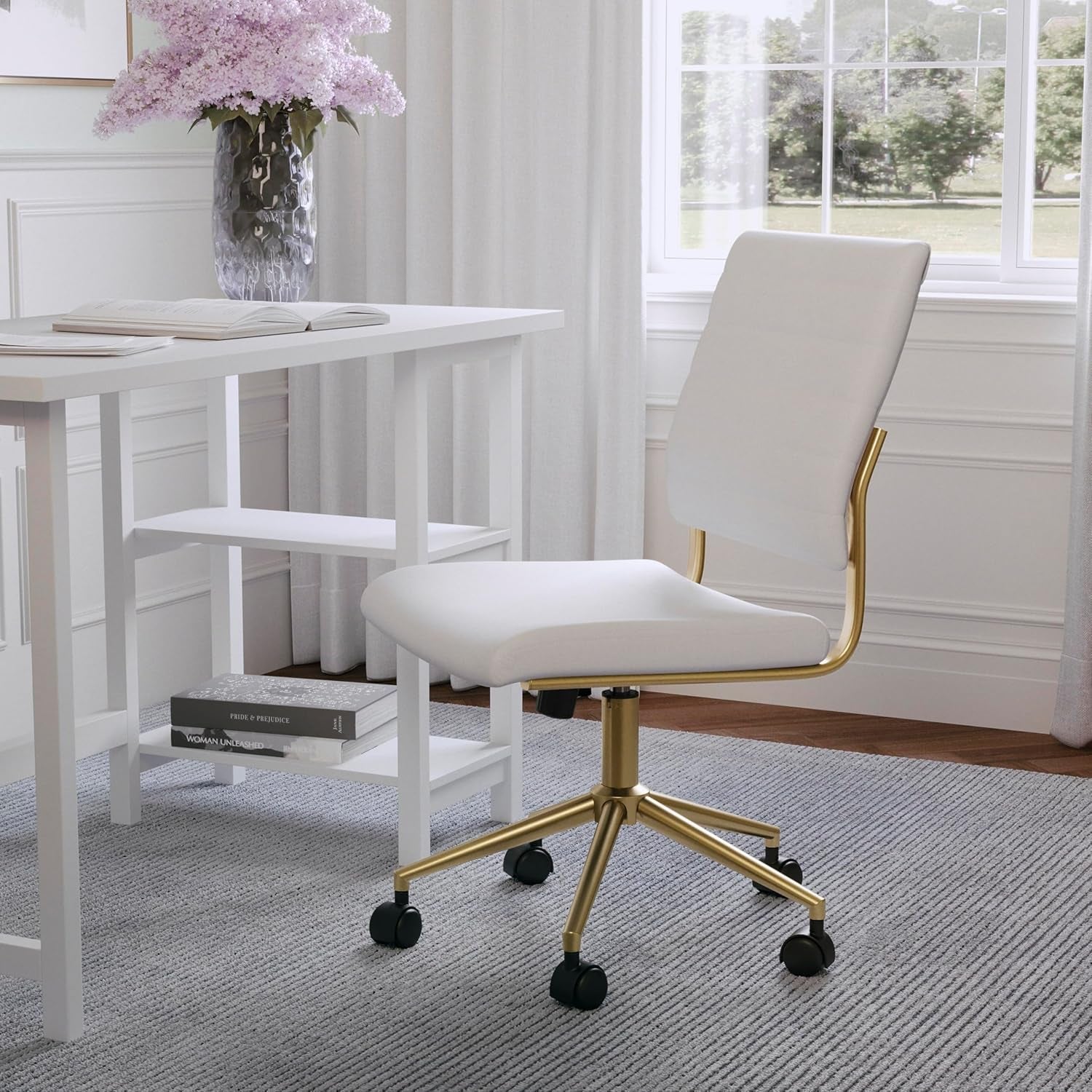 White office chair with gold accents in a room with a desk and window.