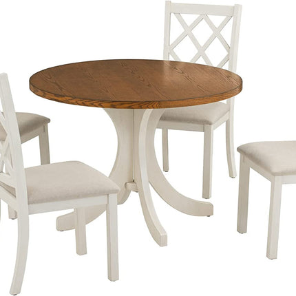 Round wooden table with four matching white chairs on a white background