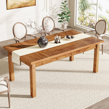 Wooden dining table with a runner and decorative items in a bright room.
