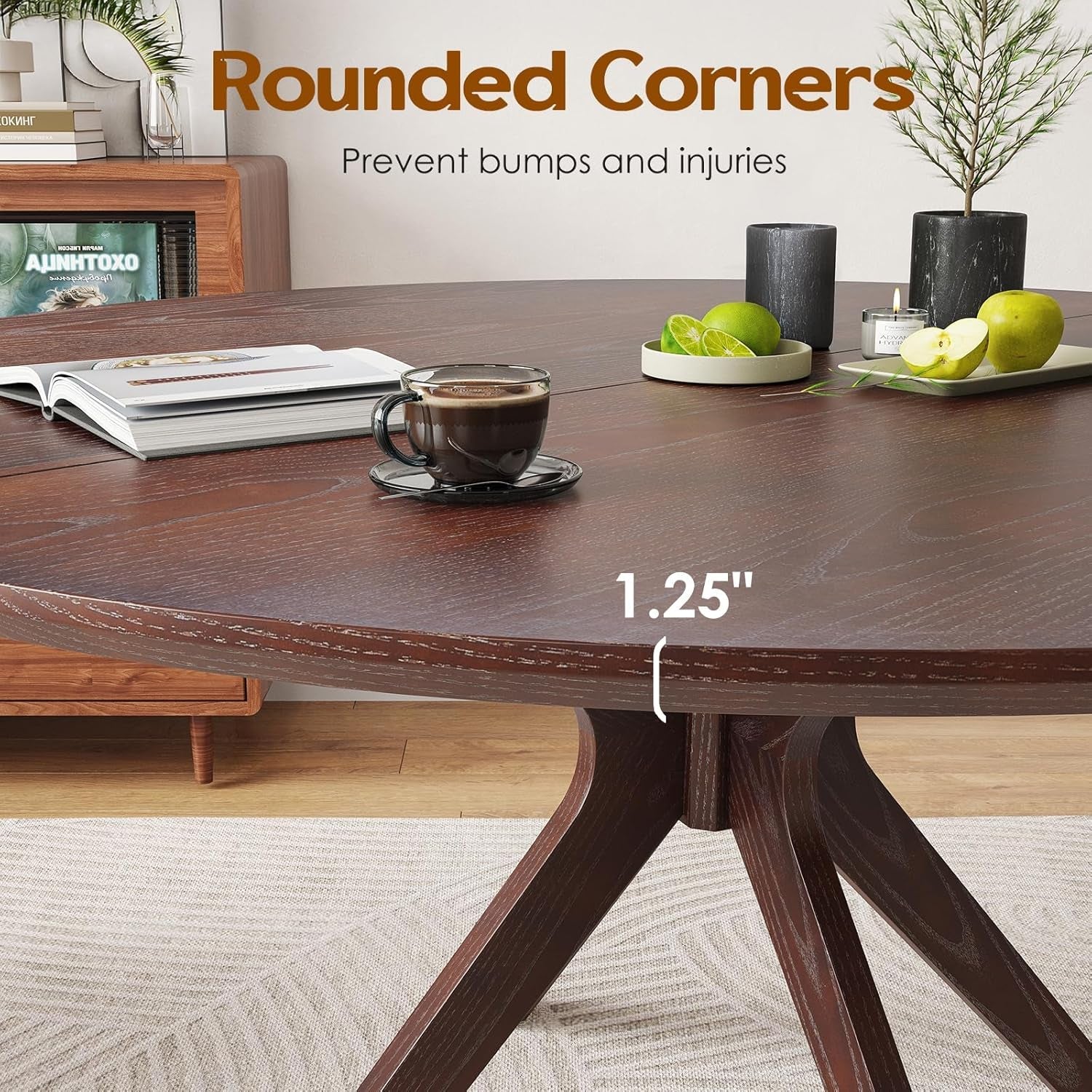 Wooden dining table with rounded corners, coffee cup, and apples in a home setting.