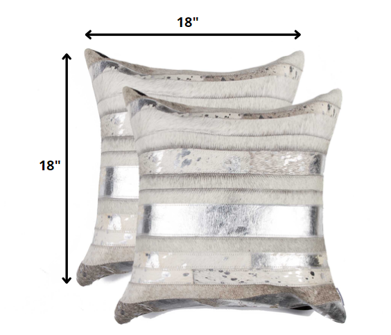 Two decorative pillows with a striped pattern and dimensions on a white background