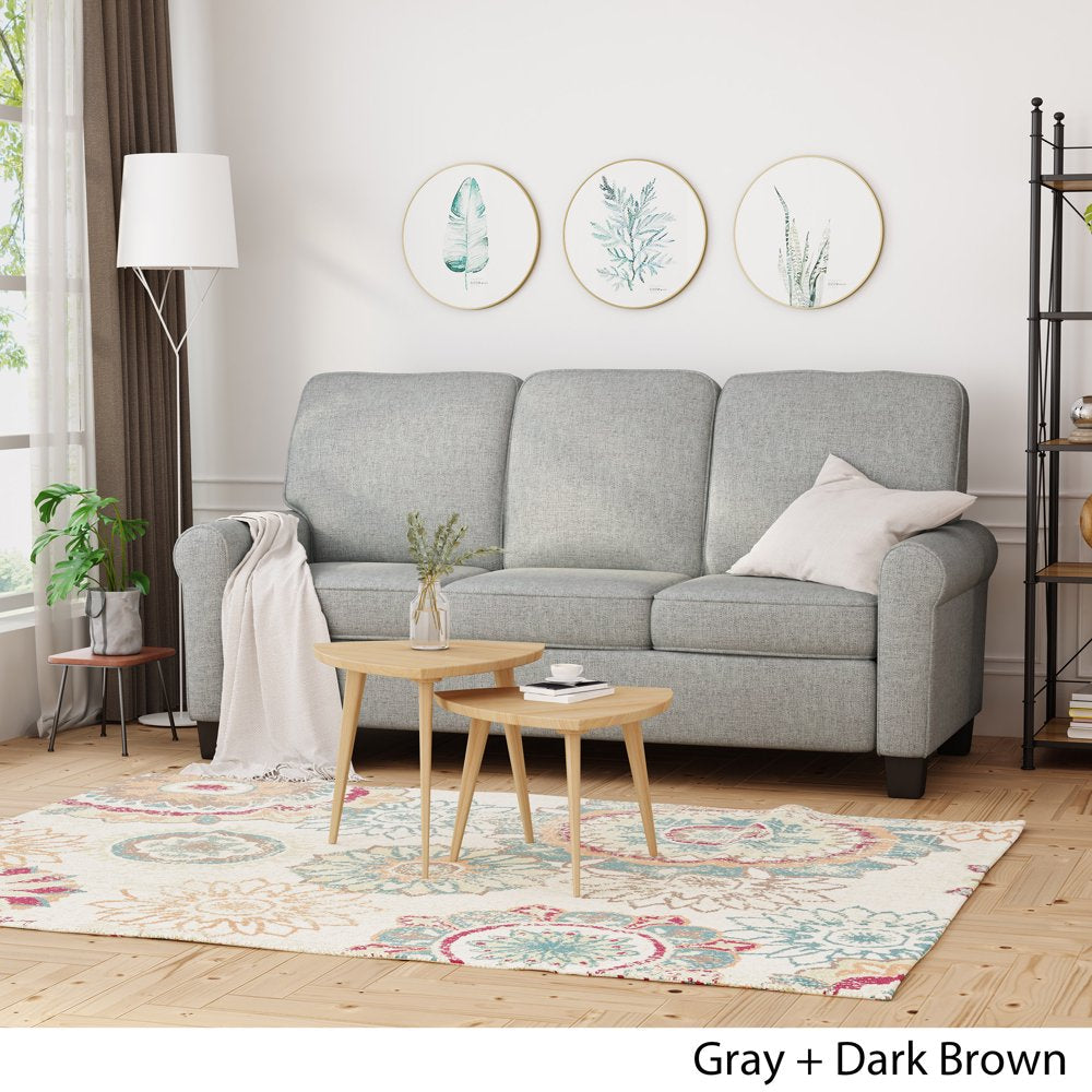 Gray sofa in a living room with wooden coffee table and decorative elements.
