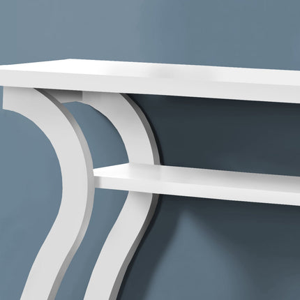 White console table with curved legs against a blue wall