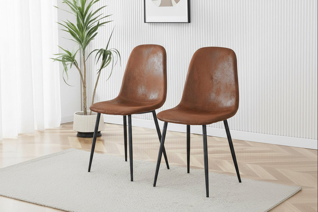 Two brown chairs with a curved backrest in a room setting, emphasizing comfort and design.