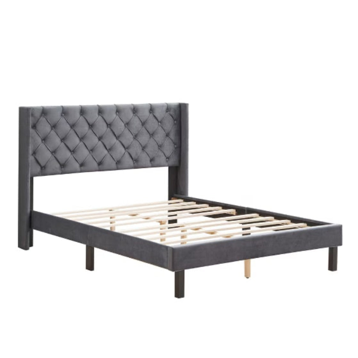 Gray tufted bed frame on a white background