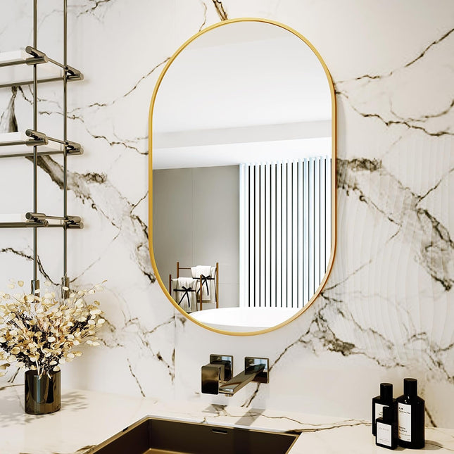 Bathroom with oval mirror, sink, and decorative elements on marble wall
