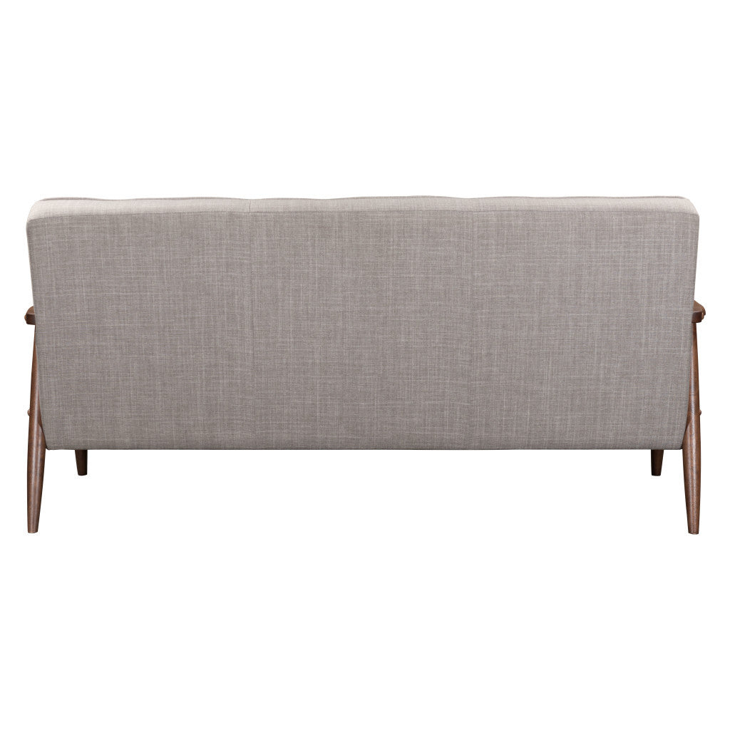 Gray upholstered bench with wooden legs on a white background