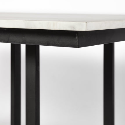 Round table with marble top and black metal legs on a white background