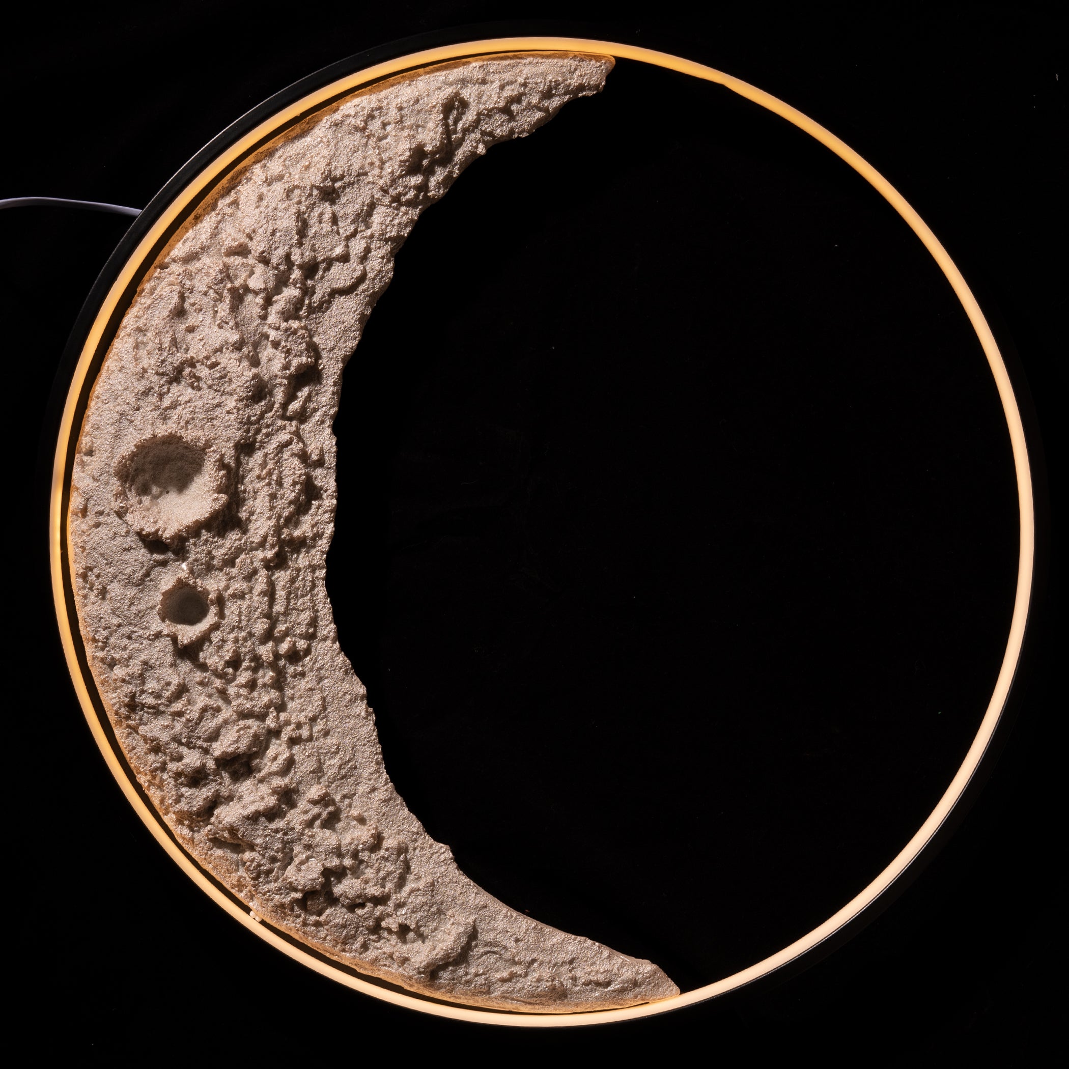 Model of a lunar surface with craters on a black background