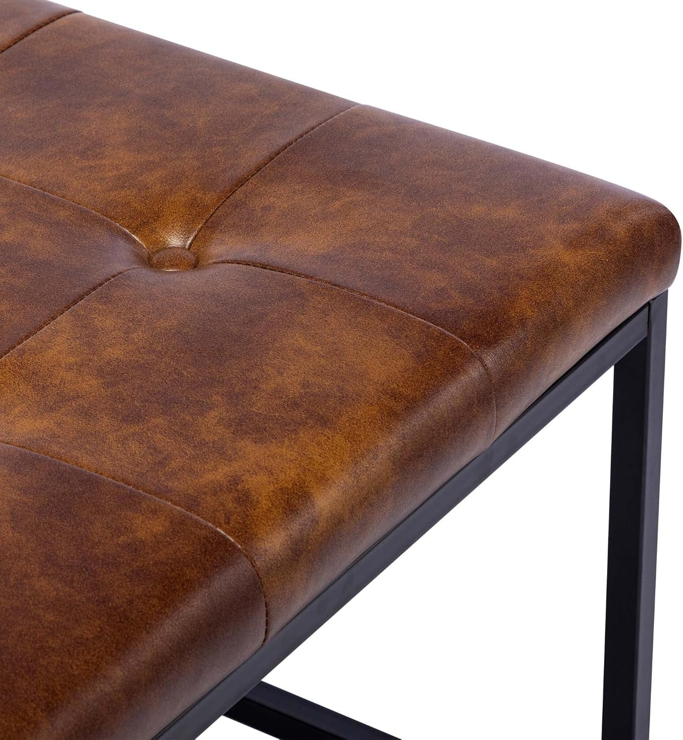 Brown leather bench with black metal legs on a white background