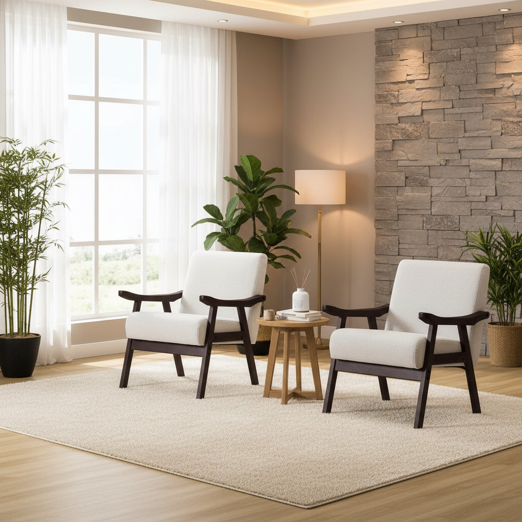Two white armchairs with dark wooden frames in a room with a window and table.