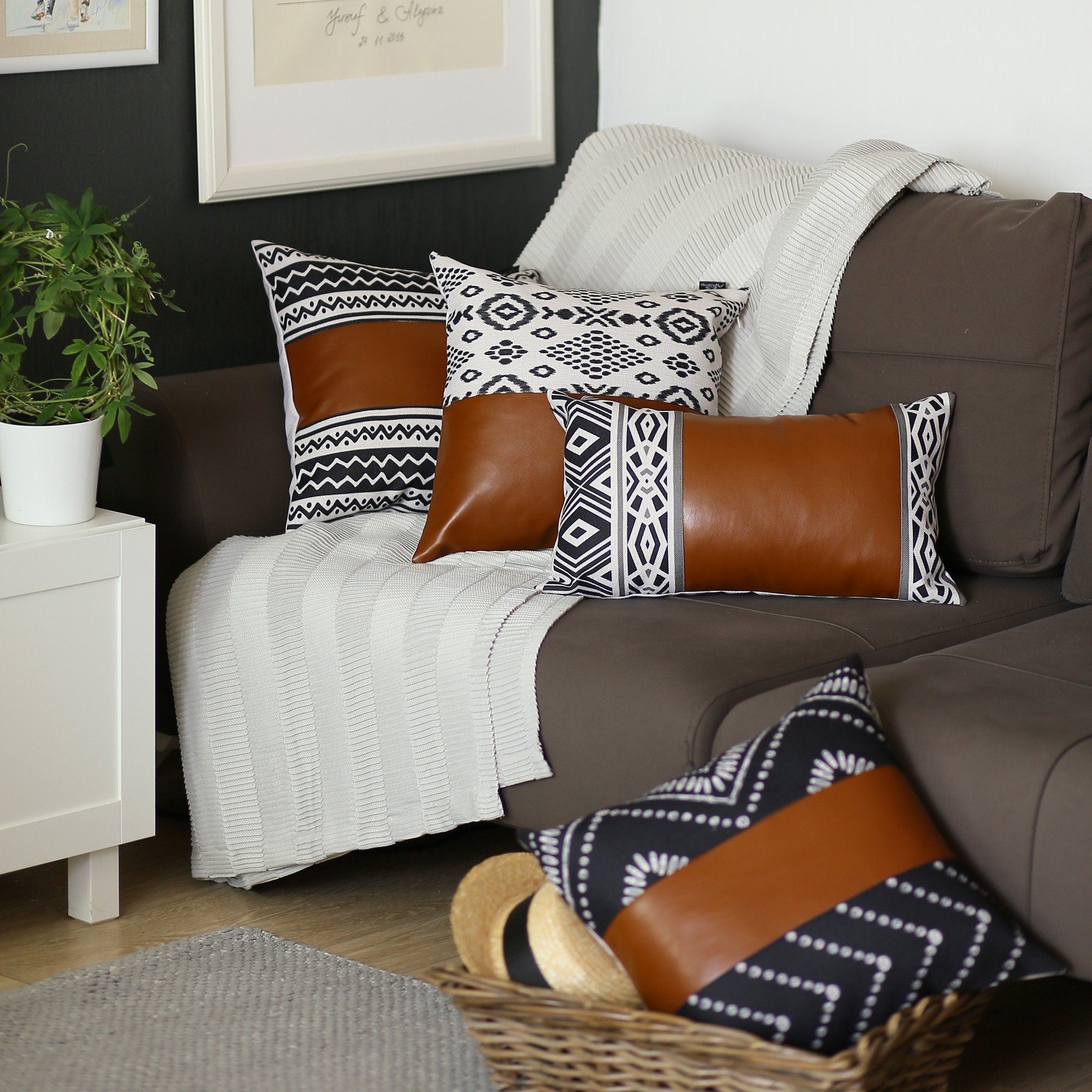 Brown sofa with patterned cushions in a living room setting