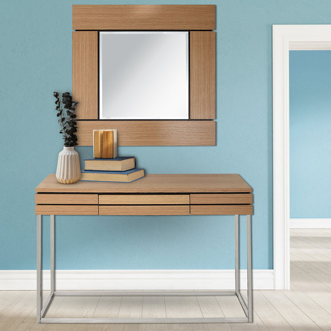 Wooden console table with mirror against a blue wall