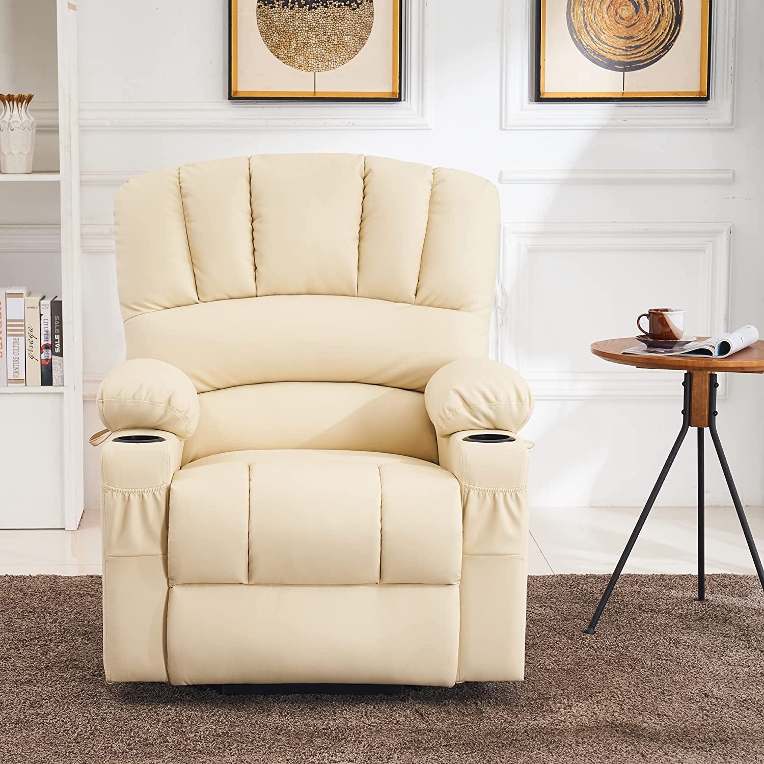 Beige recliner chair in a living room setting with a side table and framed artwork on the wall.