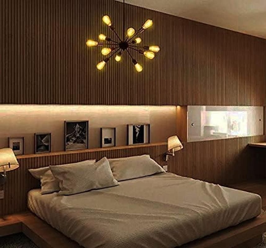 Modern bedroom with a chandelier, bed, and wall art.