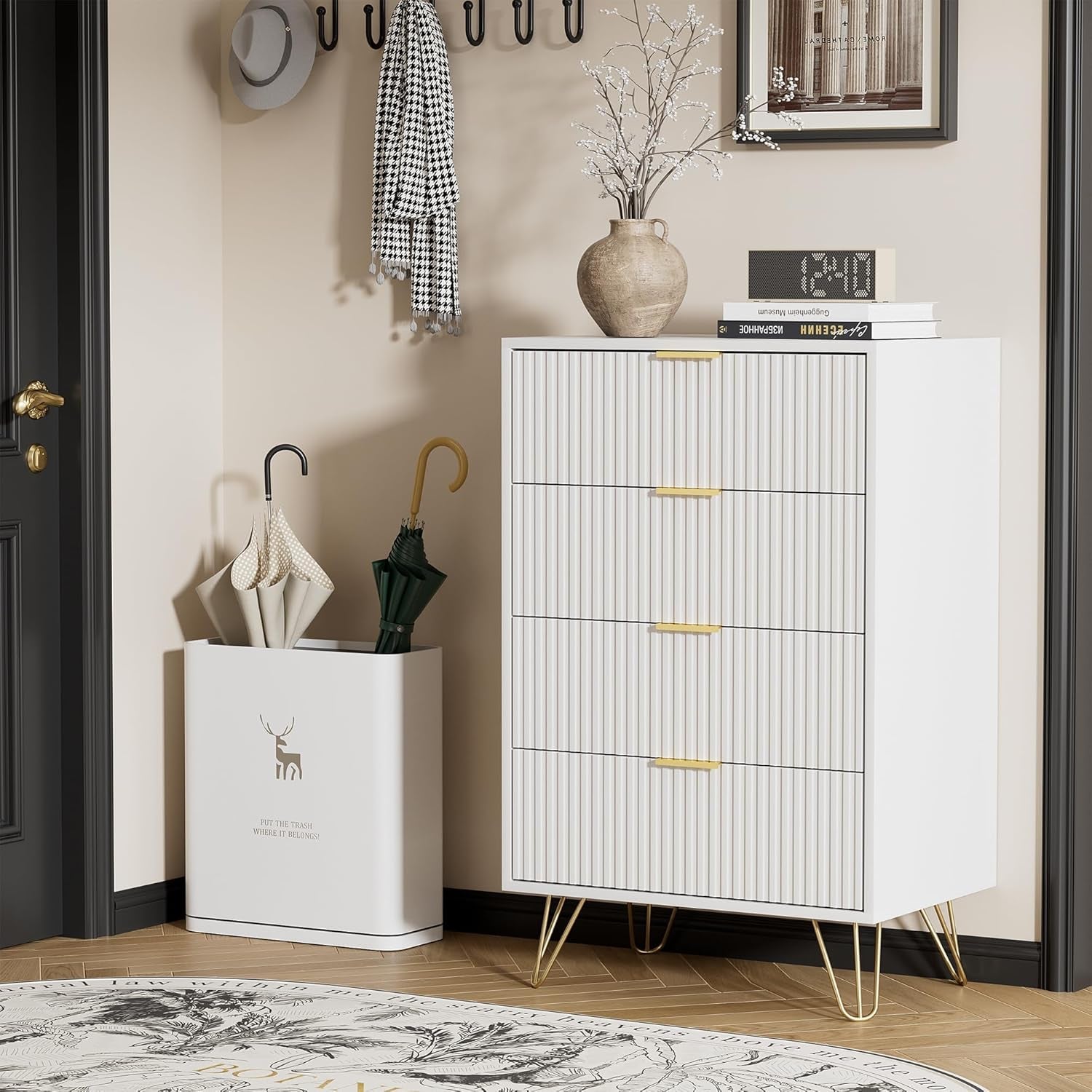 White cabinet with gold legs in a room setting with decor items.