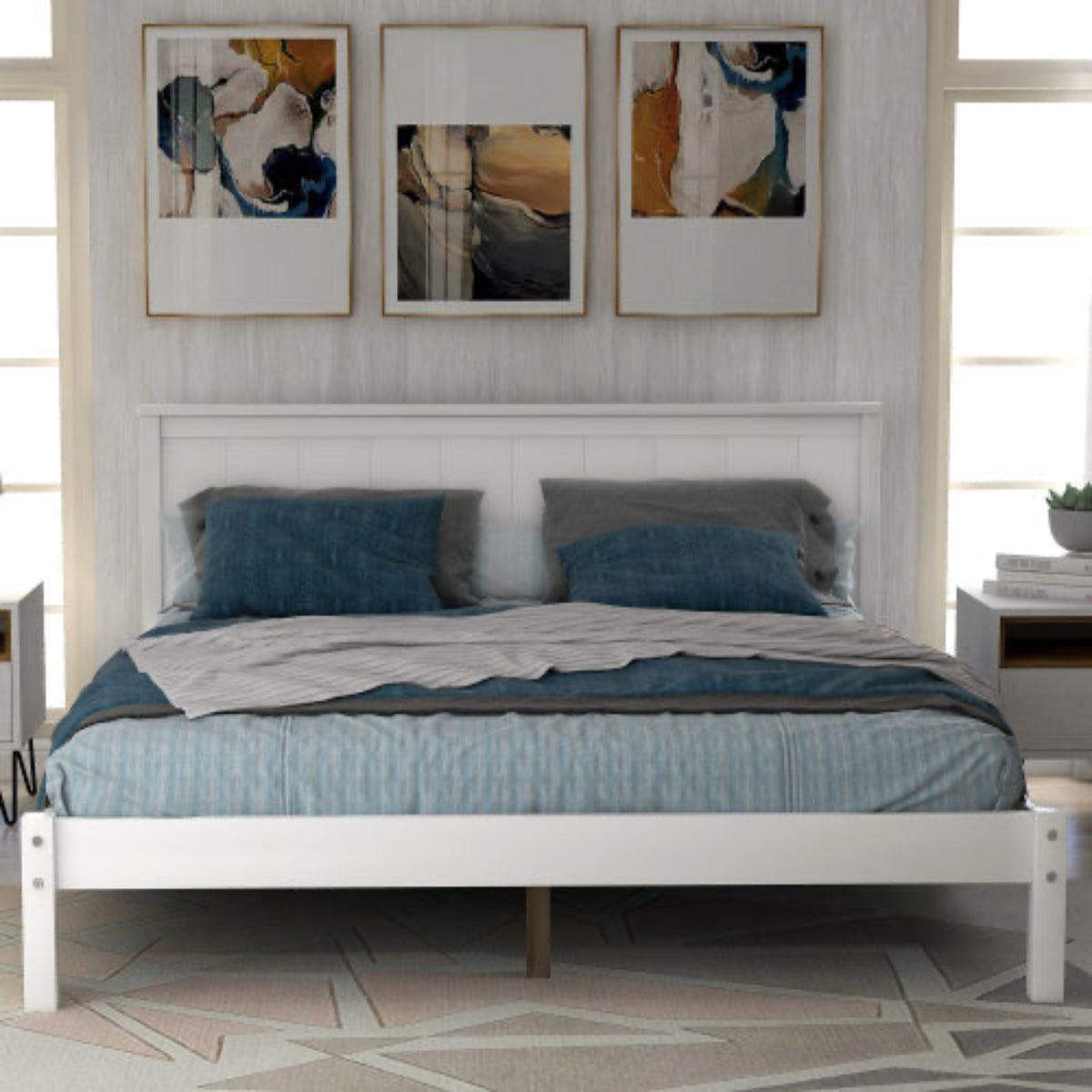 Bedroom with a white bed frame, blue bedding, and abstract art on the wall.