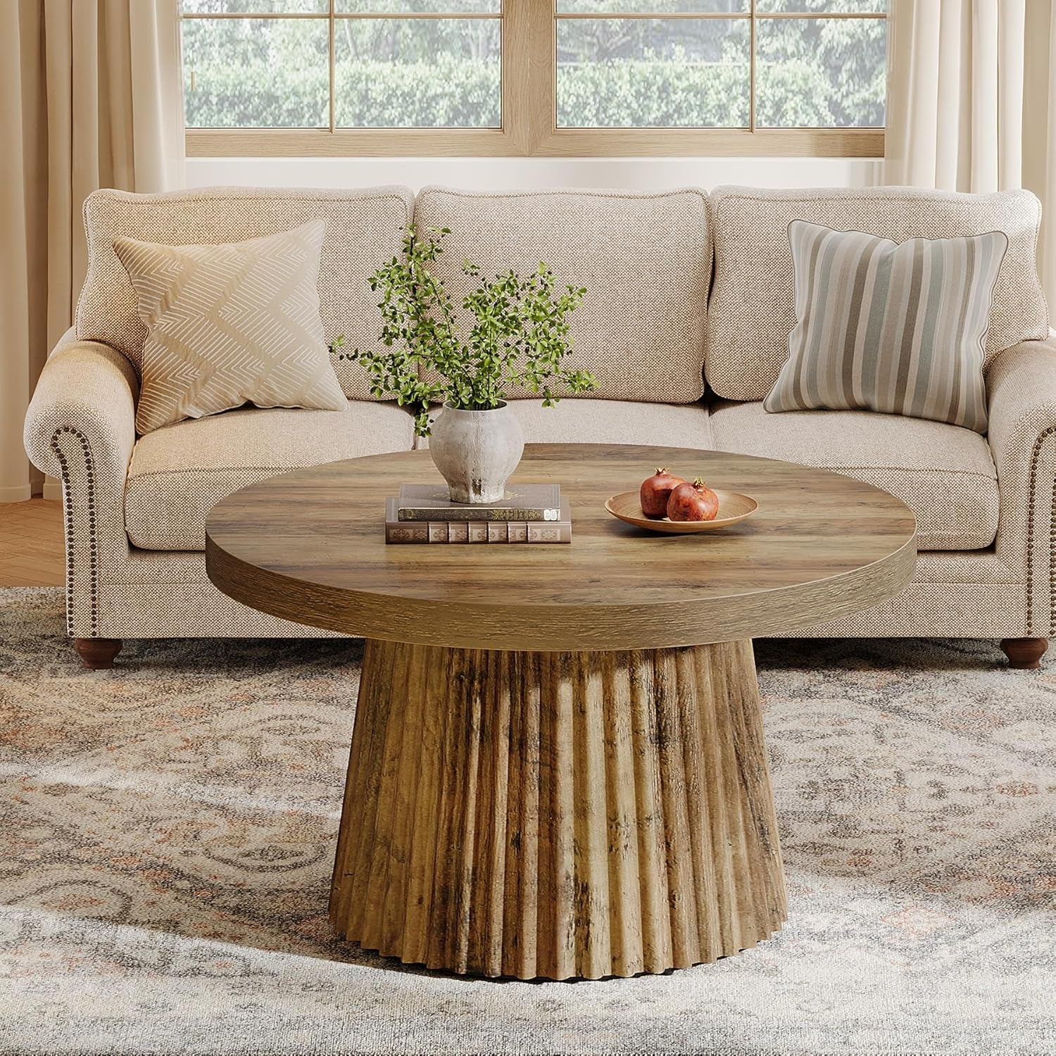 Living room with a beige sofa, wooden coffee table, and decorative items.