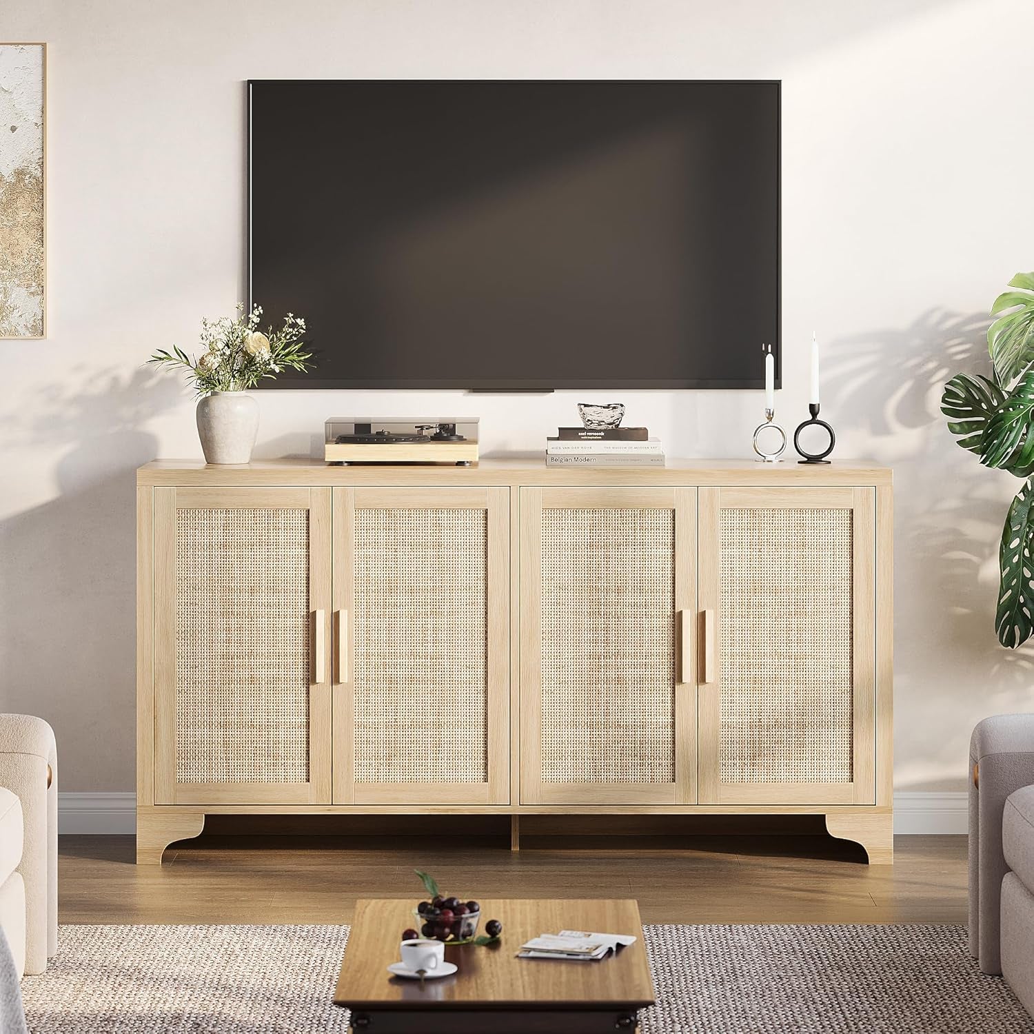 Light wood entertainment console with glass doors in a living room setting.