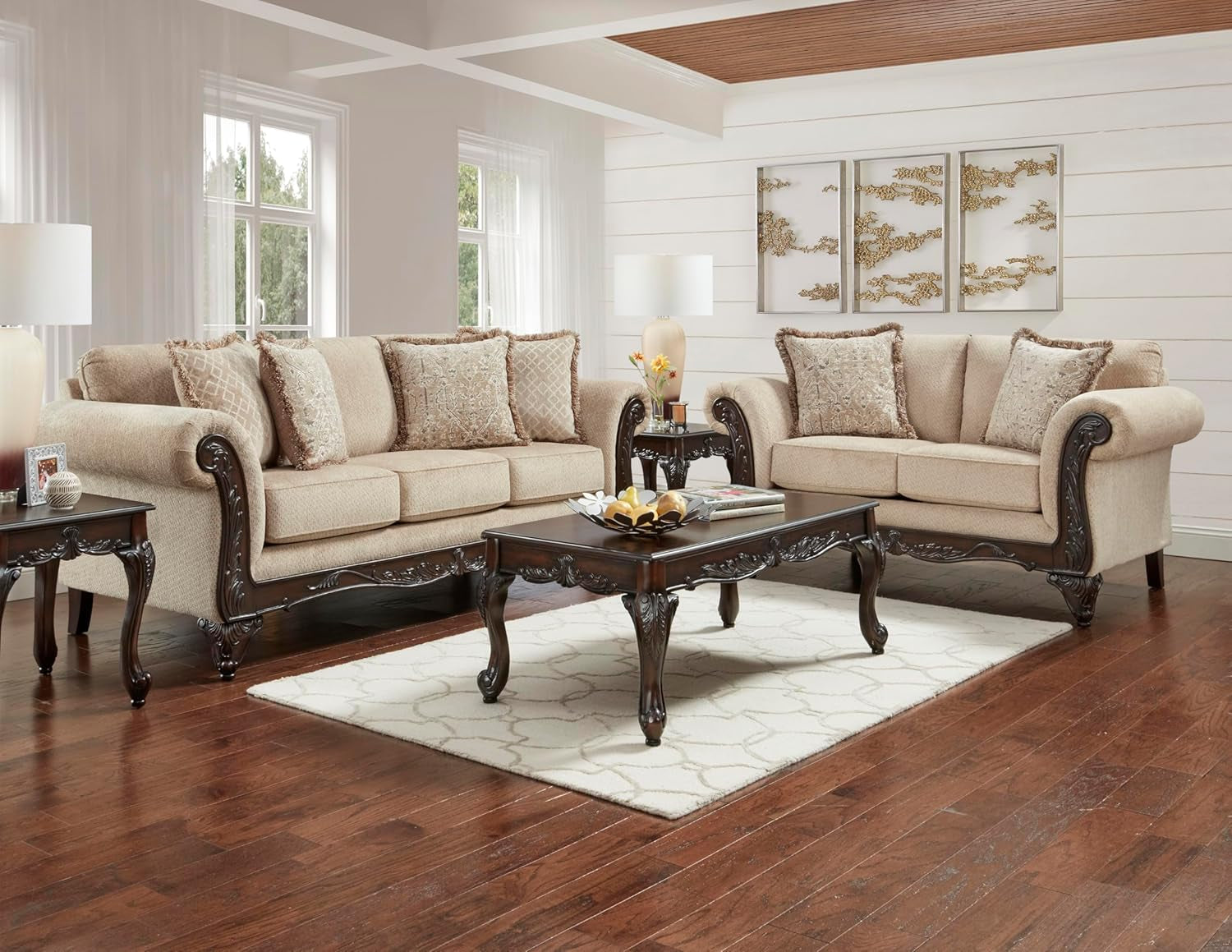 Beige sofa set in a living room with wooden floor and white walls