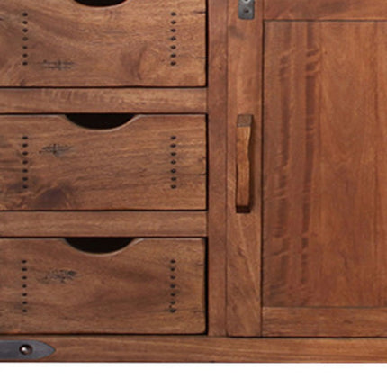 Close-up of a wooden cabinet with drawers and a door.