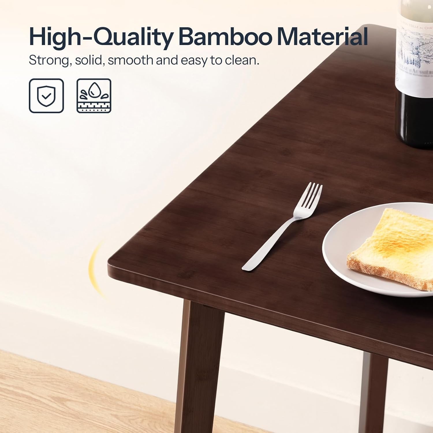Brown wooden table with a plate of toast and a fork, featuring high-quality bamboo material text.