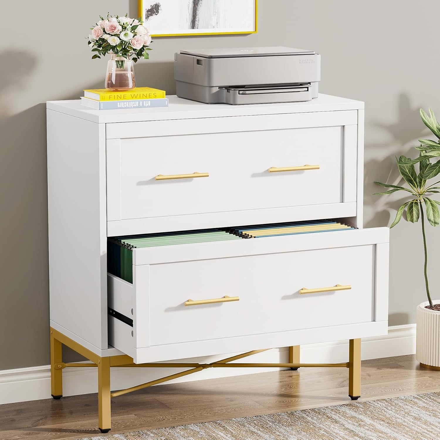White filing cabinet with gold handles in a home office setting