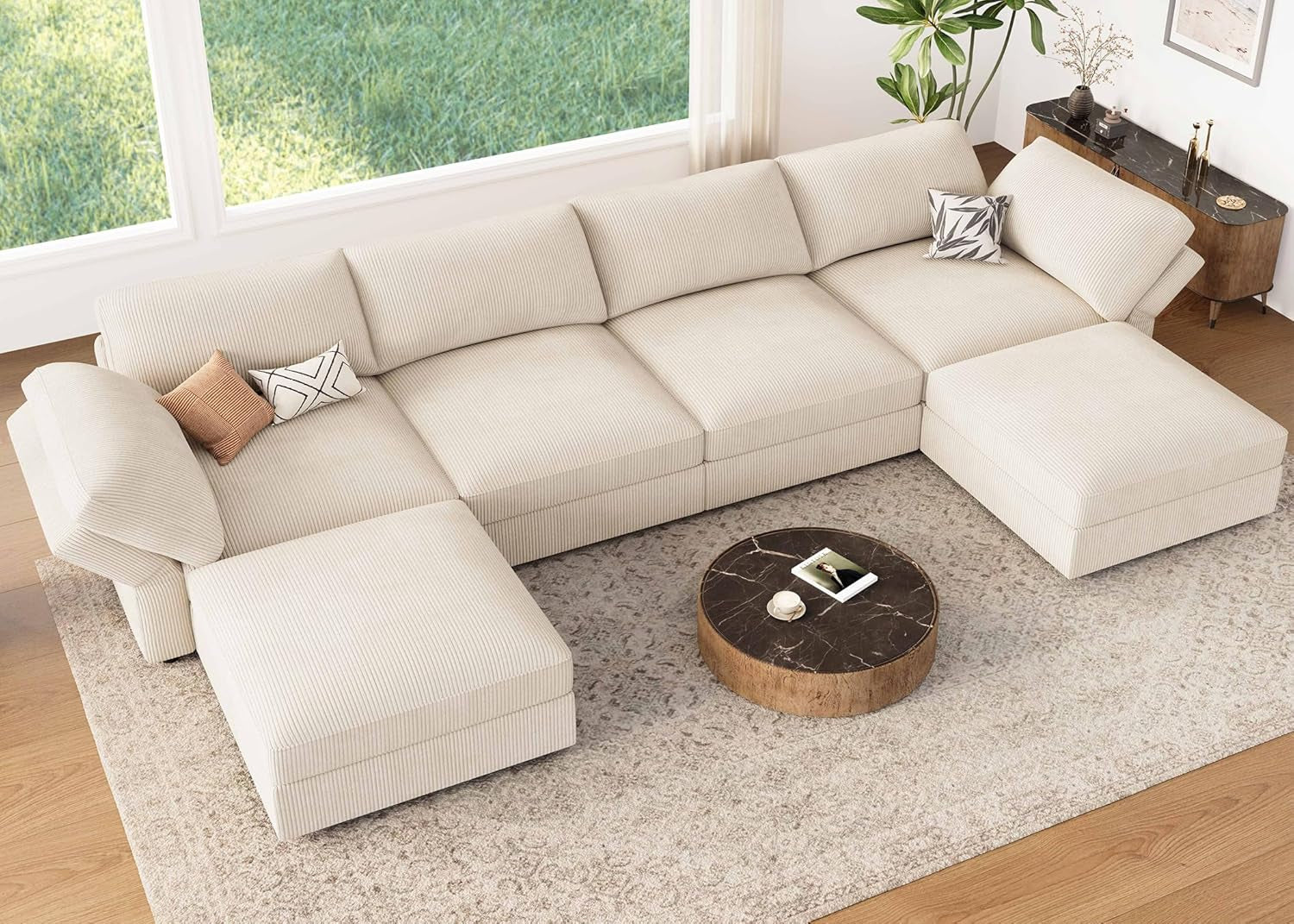 Beige sectional sofa in a living room with a coffee table and decorative items.