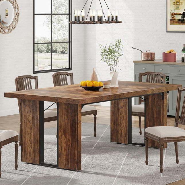Dining room with a wooden table and chairs in a well-lit room.