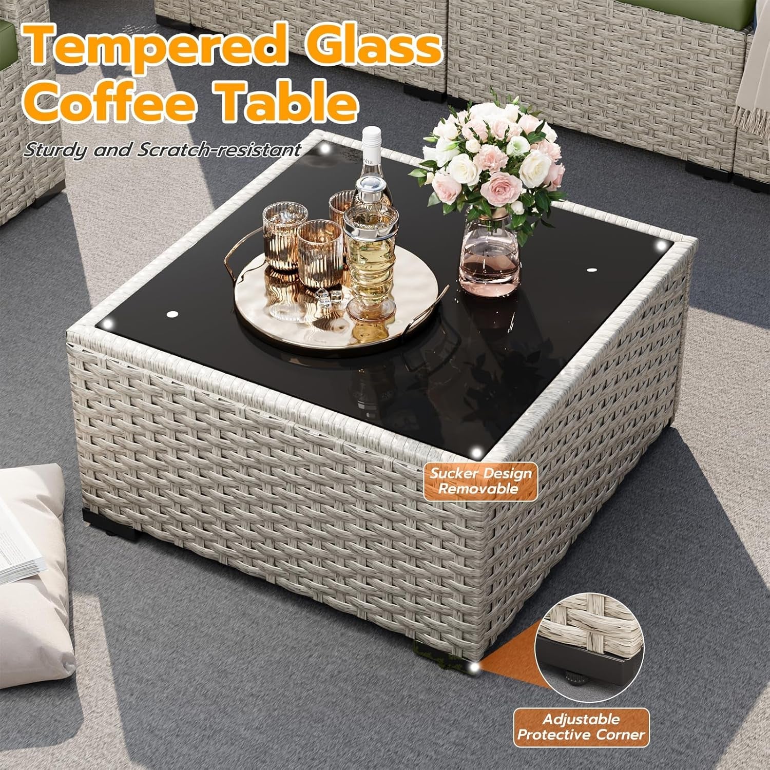 Tempered glass coffee table with decorative items on a gray floor.