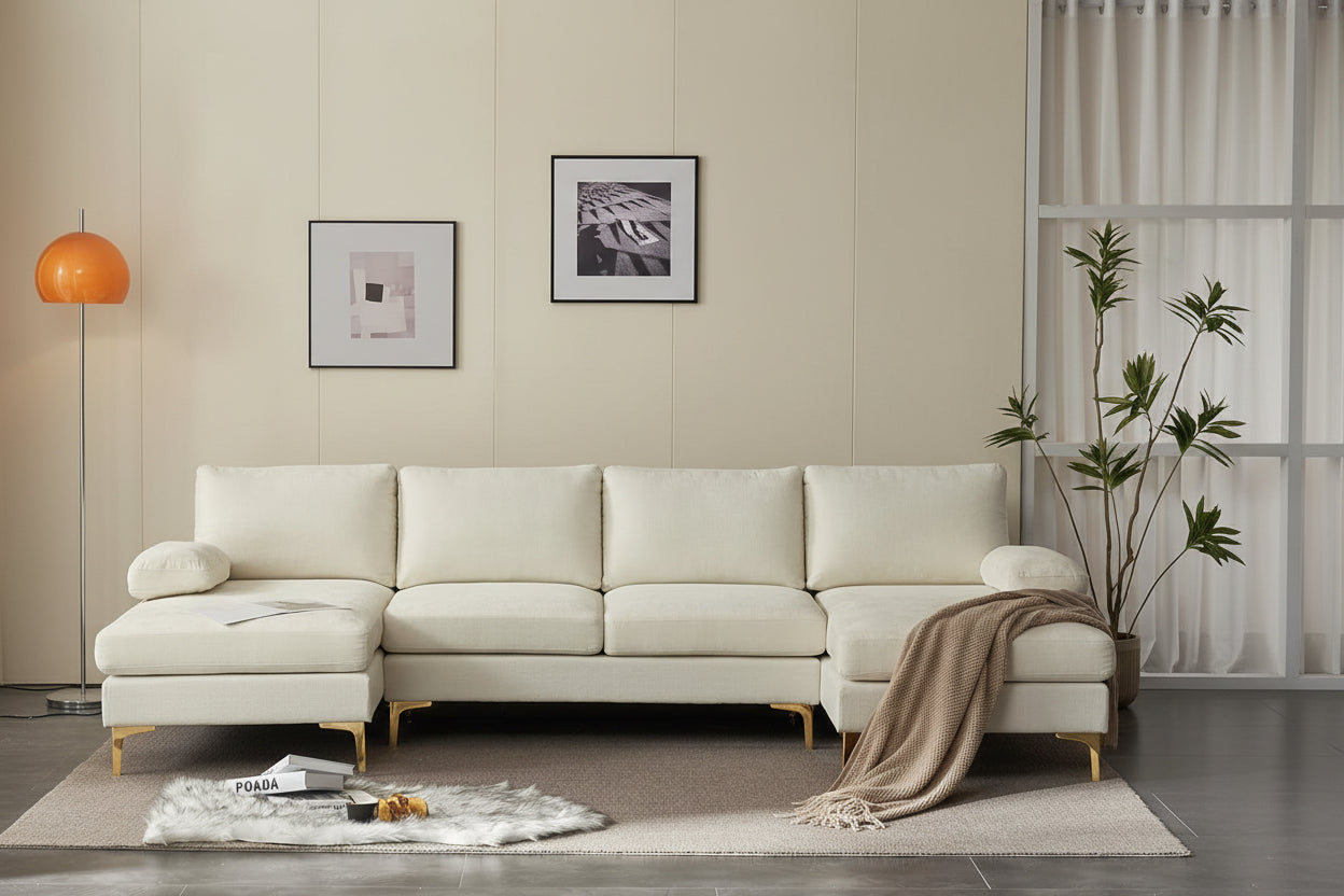 Beige sectional sofa in a living room with dark walls and decor.