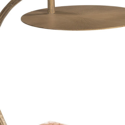 Close-up of a gold metal table with a textured surface on a white background
