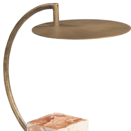 Decorative lamp with curved arm and round base on a white background
