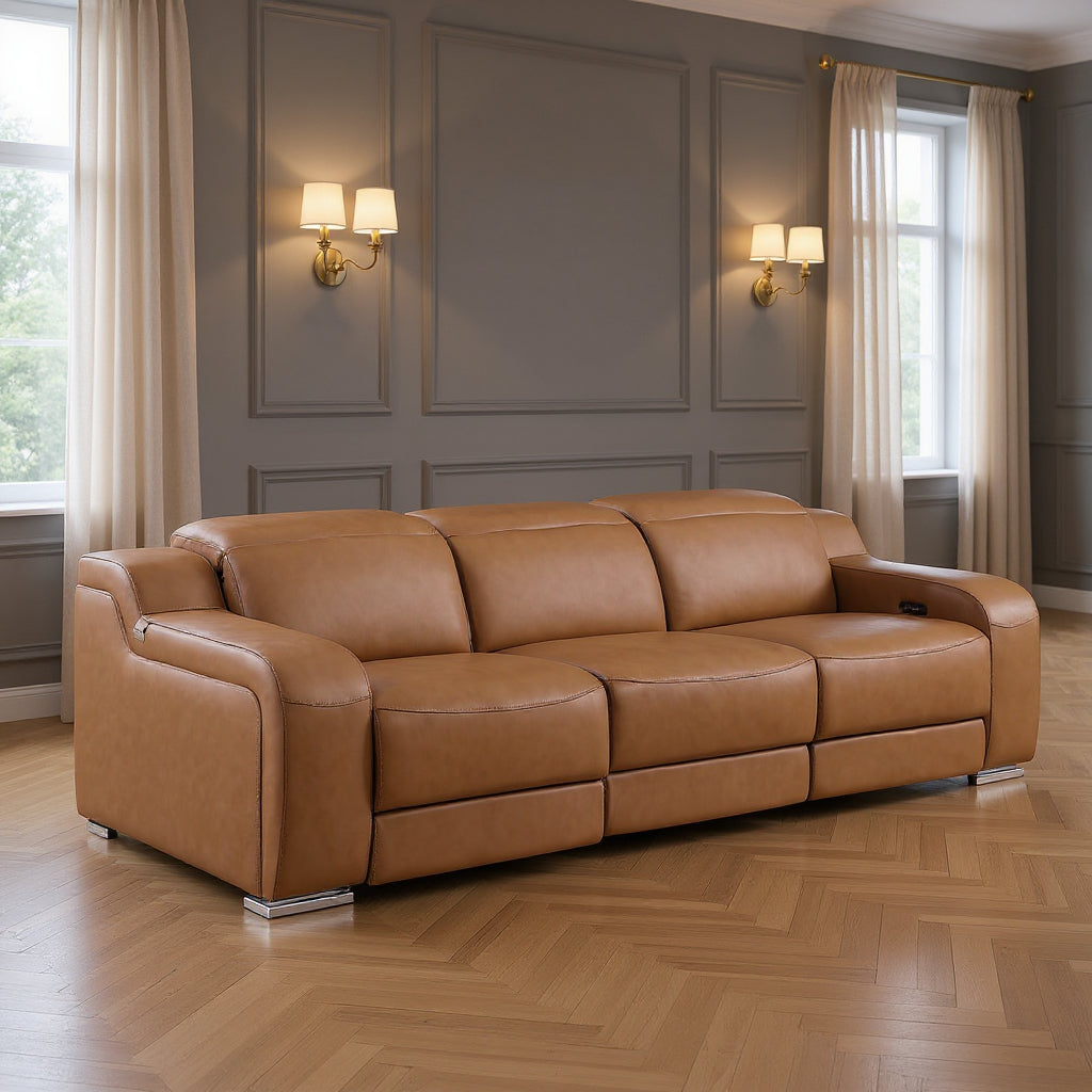 Brown leather sofa in a room with gray walls and large windows.