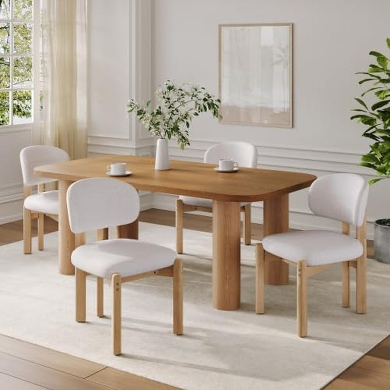 Dining room with wooden table and white chairs in a bright room.