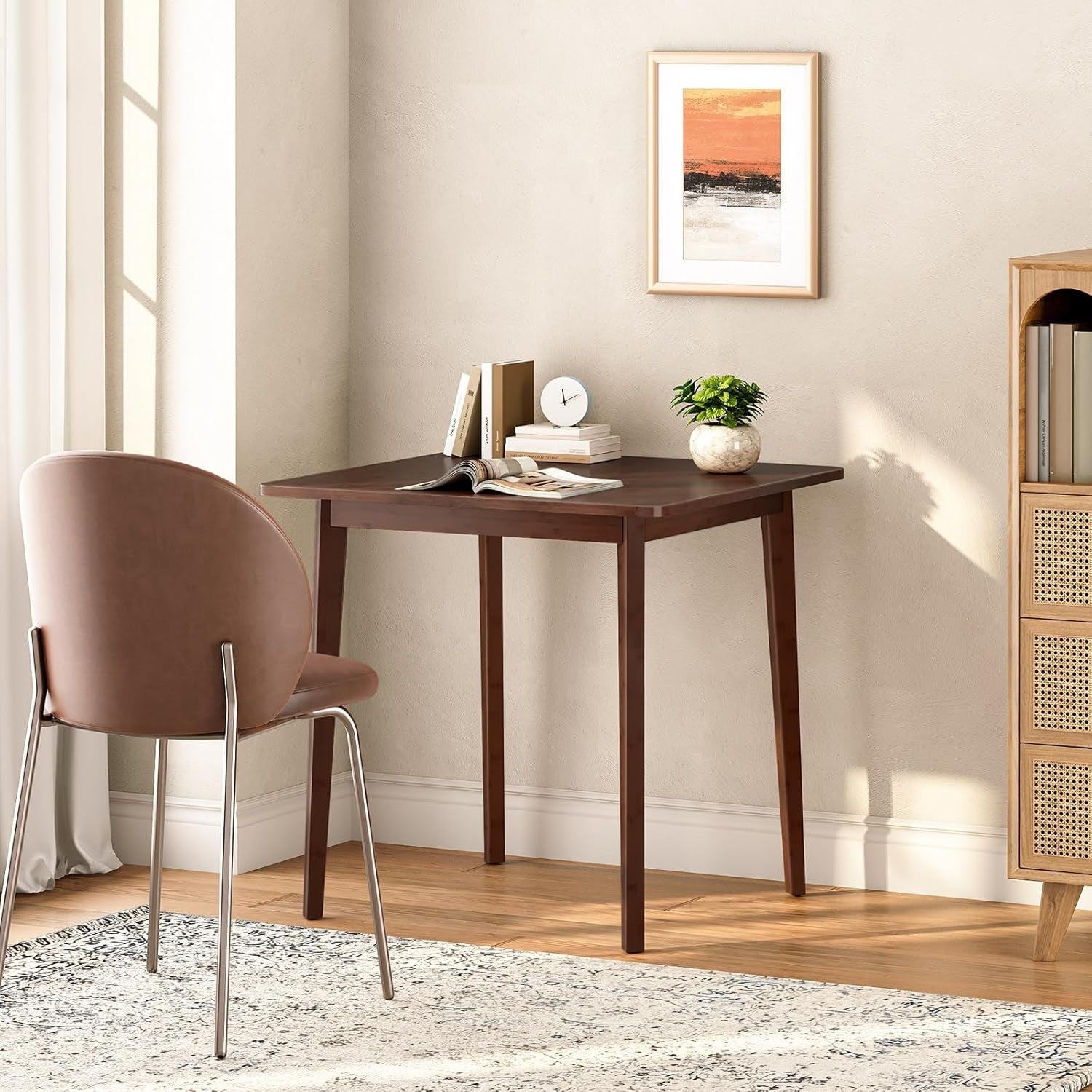 Wooden desk with chair in a room with a painting on the wall
