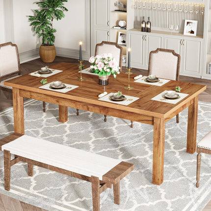 Wooden dining table set with chairs and a bench in a room with a plant and cabinets.