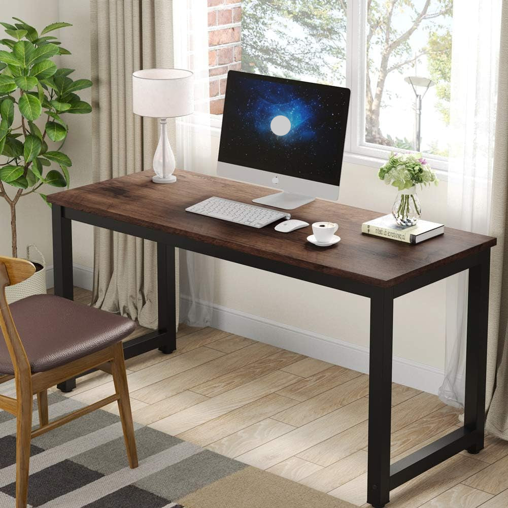 Wooden desk with computer setup in a home office setting