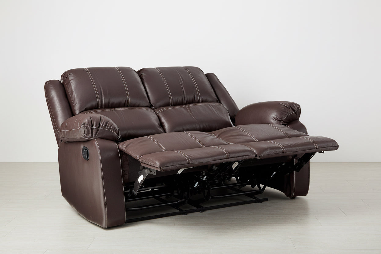 Brown leather reclining sofa on a white background
