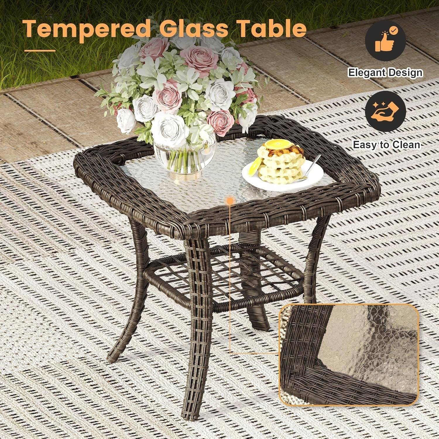 Wicker table with tempered glass top on a patio, featuring a flower arrangement and food.