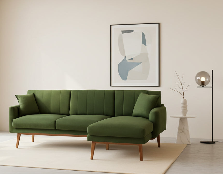 Green sectional sofa in a room with a neutral color scheme