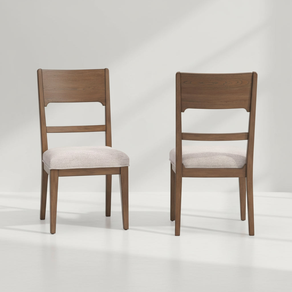 Two wooden chairs with beige cushioned seats on a white background