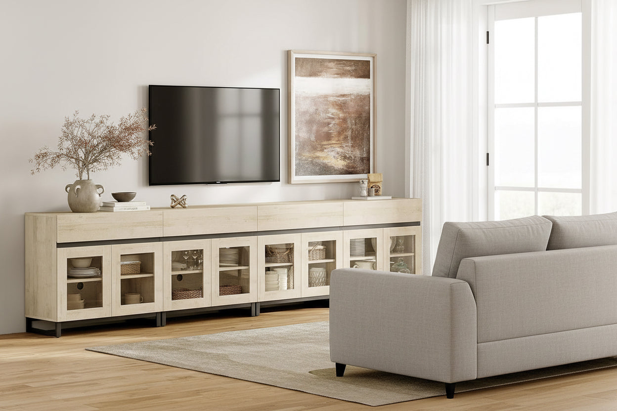 Long light wood sideboard with glass doors in a living room setting.