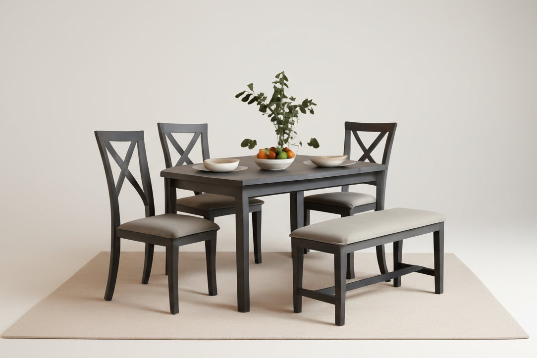 Dining room set with table, chairs, and bench against a beige wall.