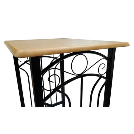 Table with a beige top and black metal base on a white background