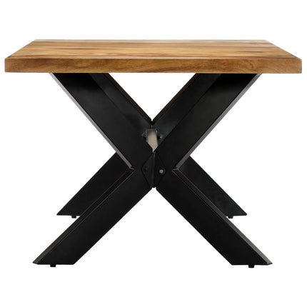 Table with wooden top and black metal X-shaped legs on a white background