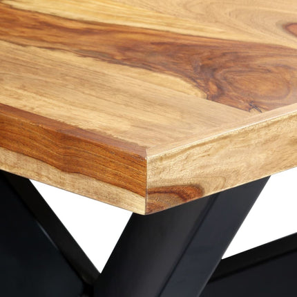 Close-up of a wooden table with black metal legs on a white background