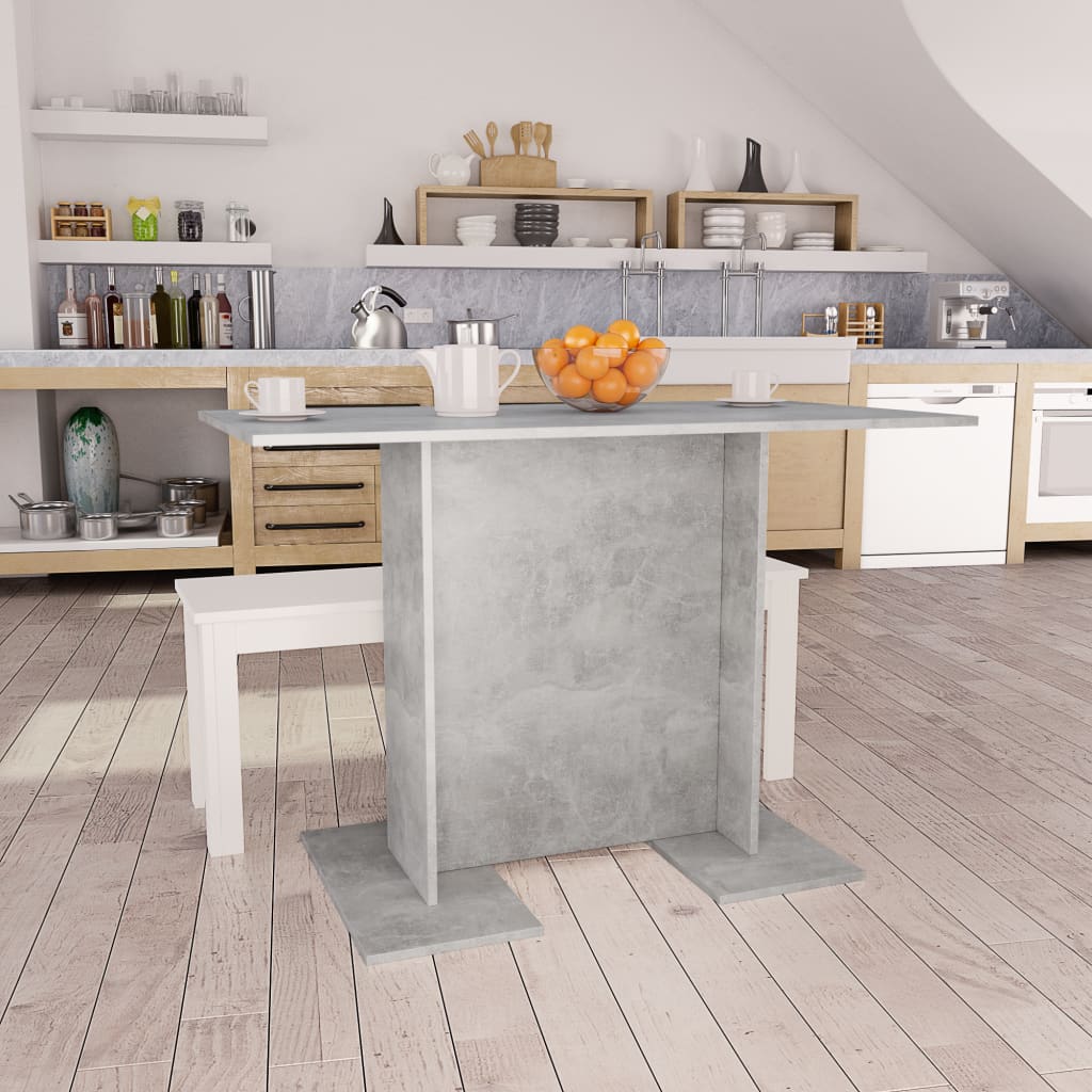 Modern kitchen with a concrete island and wooden shelves.